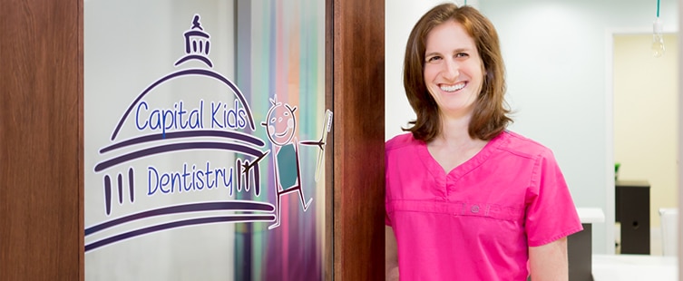 Dr. Jessica Rubin standing by door of Capital Kids Dentistry