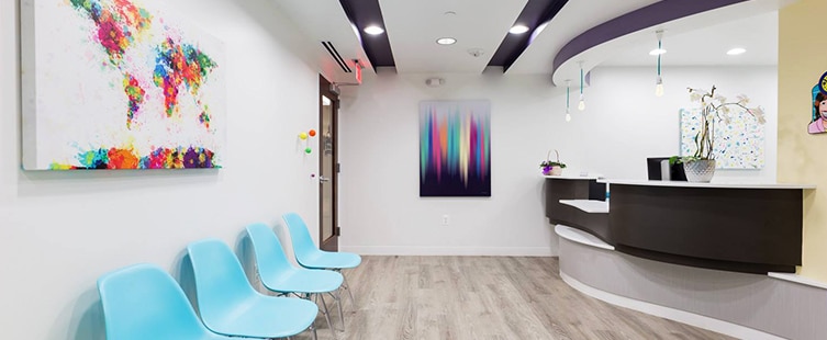 dental reception area with turquoise seats